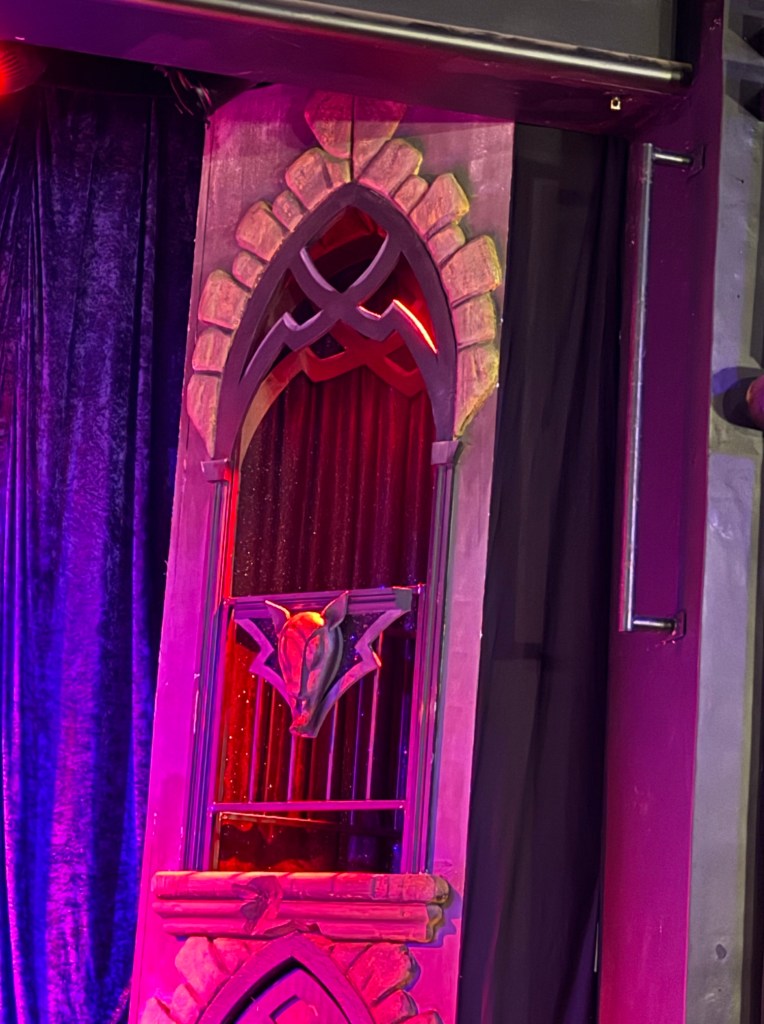 One of the set doors on the stage in the form of a balcony to the side.