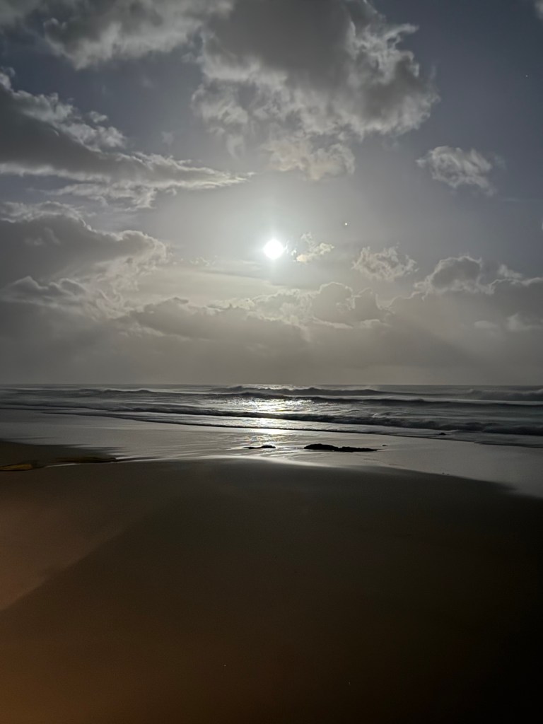 Moon shining on the beach at Cape Vidal in St Lucia.