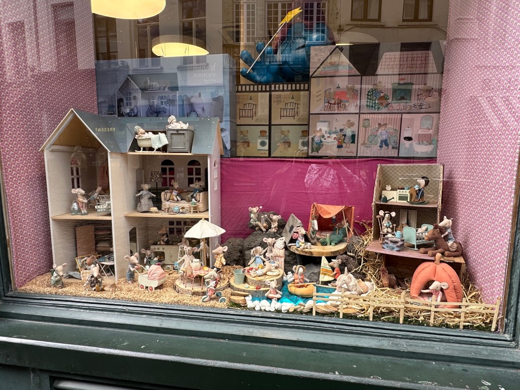 Shop window in Brussels with a delightful display of mice families toys and houses